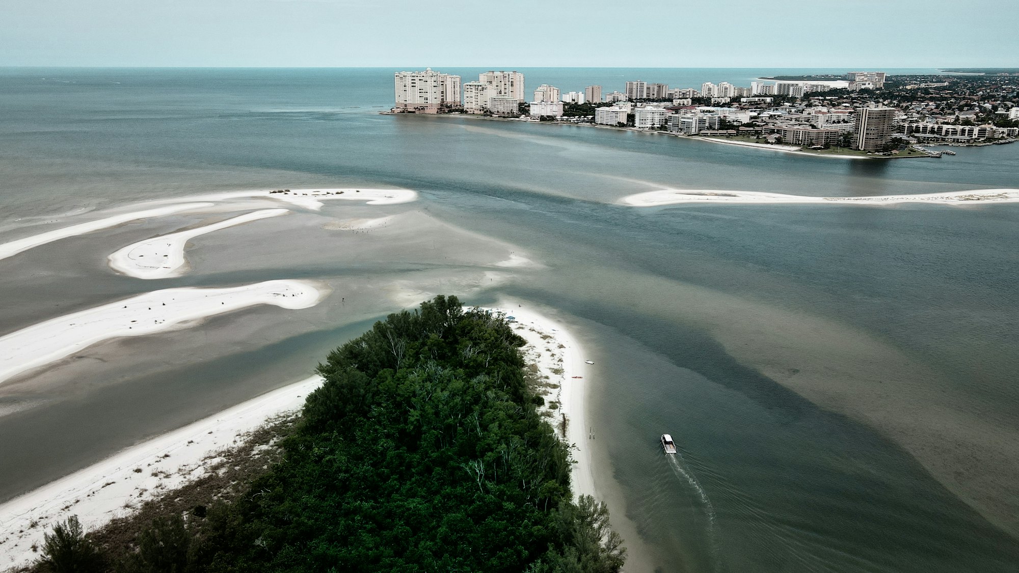 a beach with buildings in the backgroundSmoke test alt text for beach house